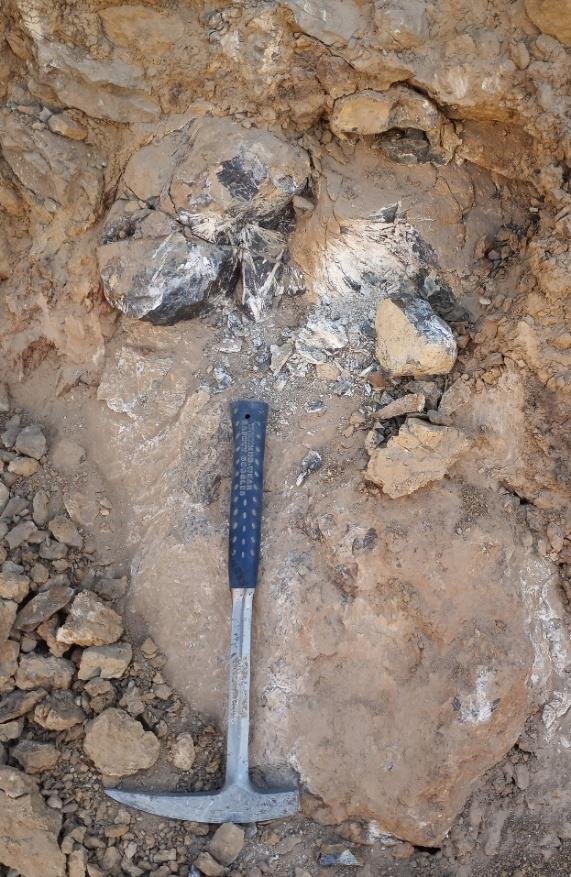 A hammer lying on the ground AI-generated content may be incorrect.