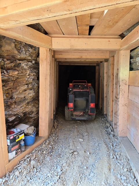A tractor in a tunnel  AI-generated content may be incorrect. 